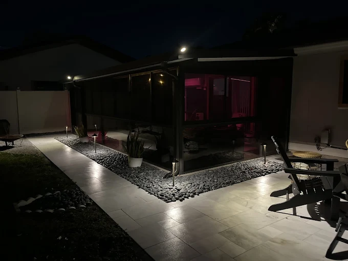 Porch and pathway uplighting at night in Casselberry FL